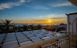 Hotel Mandetta, Blick auf den Strand bei Sonnenuntergang